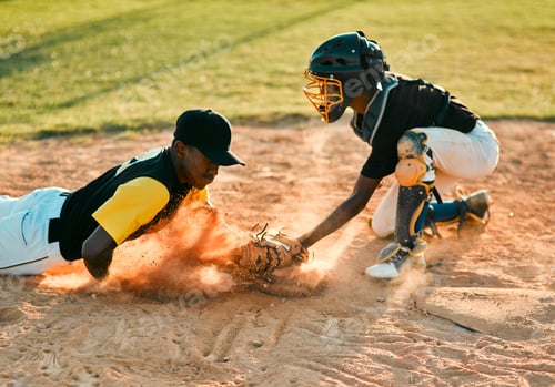 Preview: Sliding his way to victory. Shot of a baseball player sliding to the base during a baseball game.