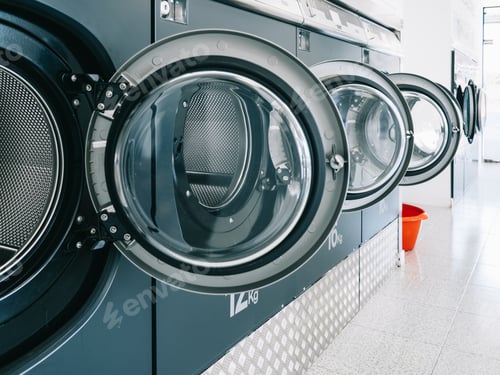 Preview: Row of washing machines in a public laundromat- concept for cleaning