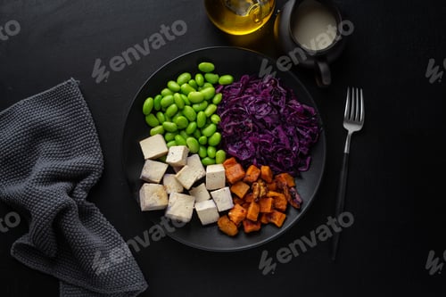 Preview: Appetizing vegan bowl with tofu on plate