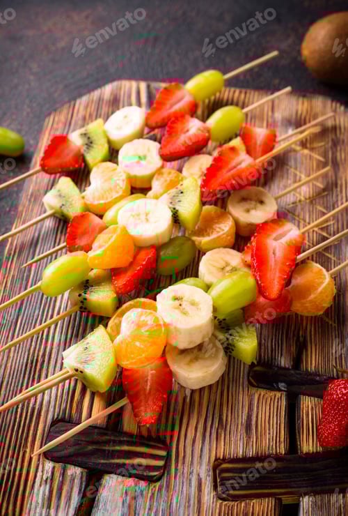 Preview: Delicious Fruit Skewers on Wooden Board