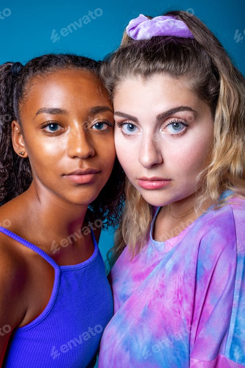 Preview: Confident diverse female models standing close and looking at camera.