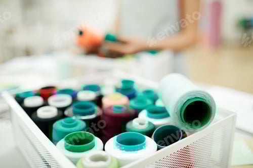 Preview: Container with colorful thread spools