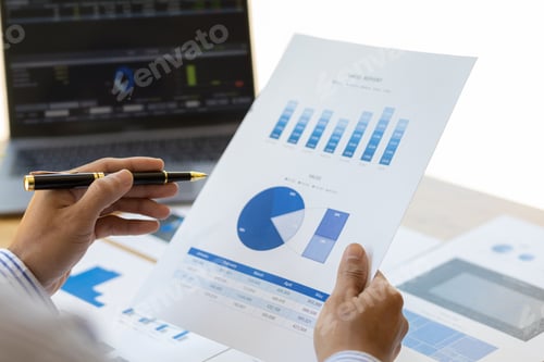 Preview: Businessman analyzing investment situation and business chart for financial planning.