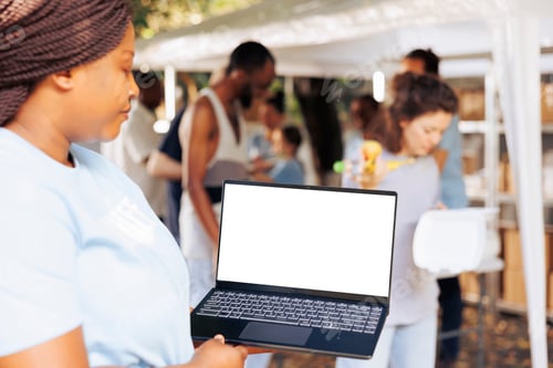 Preview: Laptop having white screen held by woman