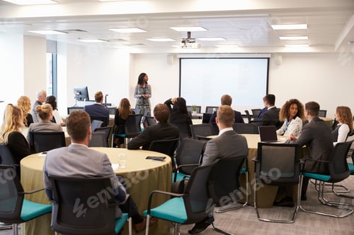 Preview: Businesswoman Making Presentation At Conference