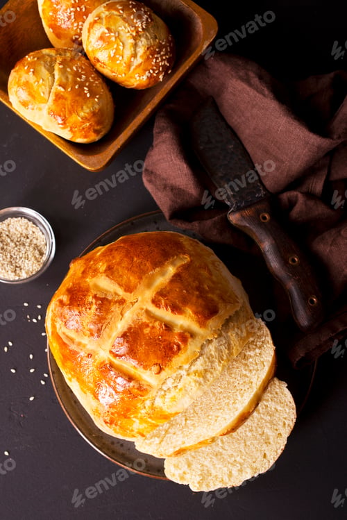 Preview: fresh bread on black table