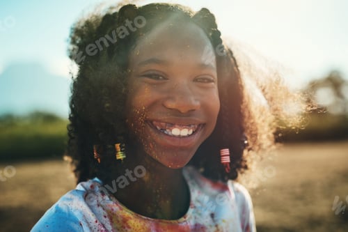 Preview: Shot of a teenage girl having fun with colourful powder at summer camp