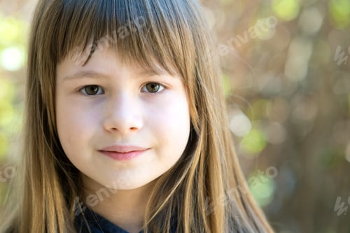 Preview: Portrait of pretty child girl with gray eyes and long fair hair outdoors