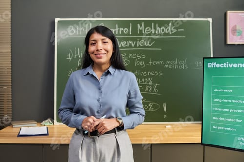 Preview: Portrait of Hispanic Woman Teaching Birth Control Methods in Classroom