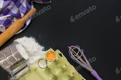 Preview: Preparation for baking. Eggs with a rolling pin. On the stone table. Free space for text . Top view.