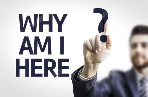 Preview: Business Man Pointing To Transparent Board With Text: Why Am I Here?