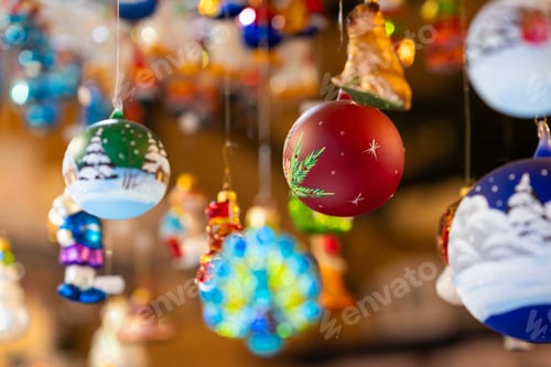 Preview: Hand-Painted Christmas Ornaments Hanging in Market
