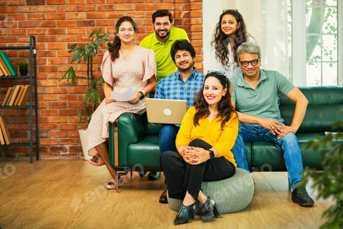 Preview: Young startup team in India celebrating success together in a modern office setting