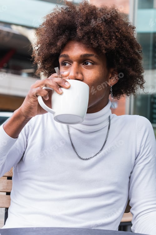 Preview: Man drinking a cup of coffee