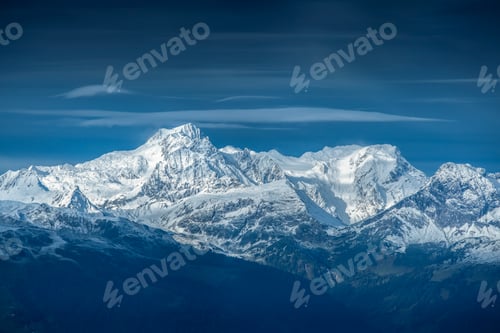 Preview: Snowy Mountain Peaks and Cloudy Blue Sky