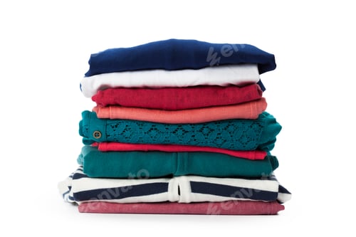 Preview: Stack of clothes on white background, closeup