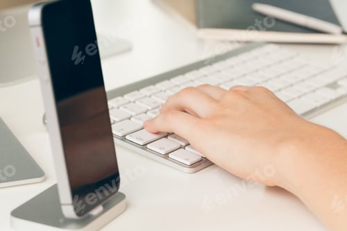 Preview: Close up of a female hands of woman office worker typing on the keyboard