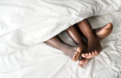 Preview: Couple lying on bed together sex concept