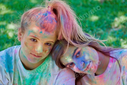 Preview: NOMINATED Two girls covered in color from having fun with colored powder