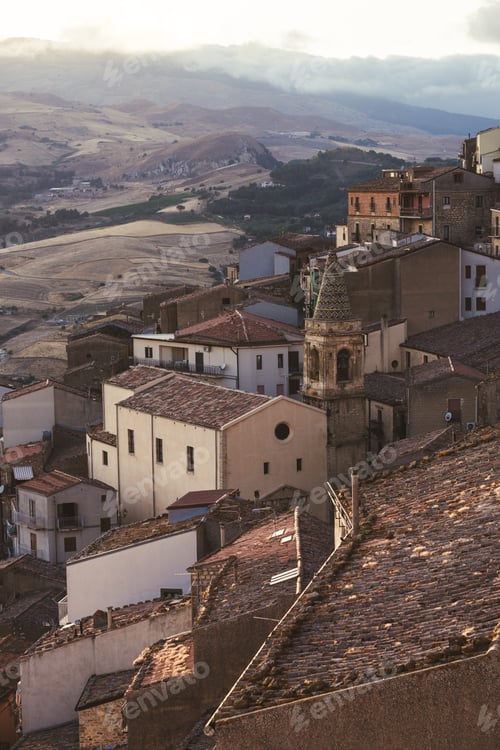 Preview: Terracotta rooftops overlooking rolling hills at sunset