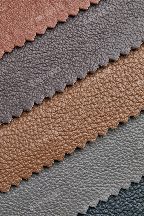 Preview: Samples of beige, brown, gray black leather. Leather crafts and craftwork. View from above.