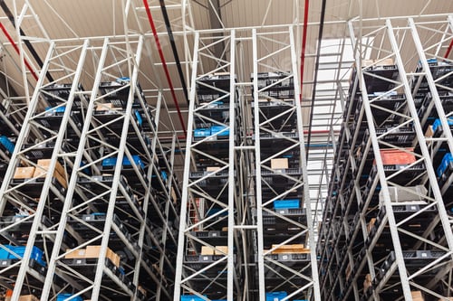 Preview: Boxes with goods is lying in big modern automatic warehouse