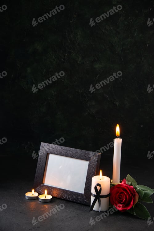Preview: front view of burning candles with picture frame on a dark background funeral evil