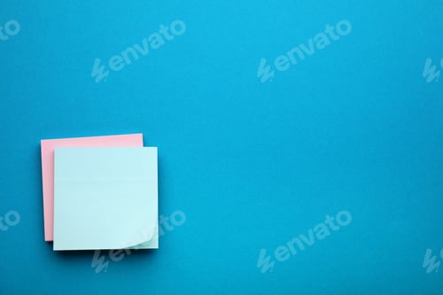Preview: Paper notes on blue background, top view