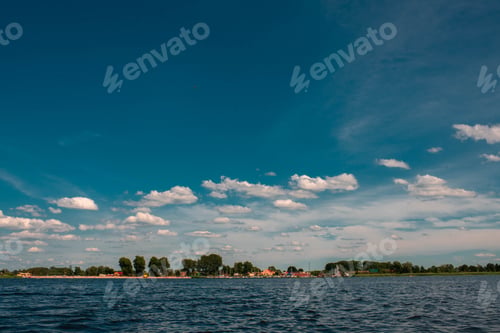 Preview: Picturesque Lake Scene with a Beautiful Blue Sky