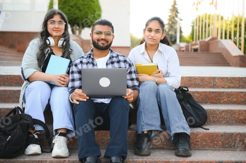 Preview: group of young students checking exam results or waiting for project approval on laptop
