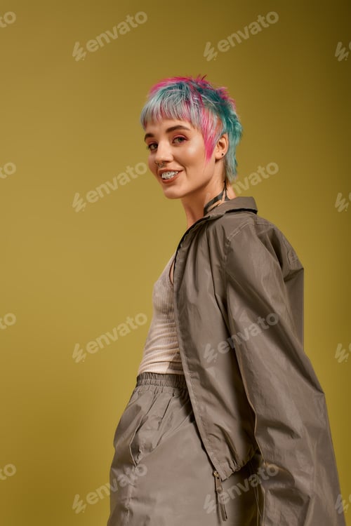 Preview: Colorful youth shines bright in studio, showcasing vibrant fashion and modern beauty