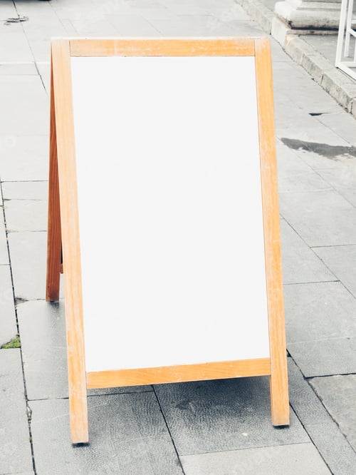 Preview: Wooden blank white menu board on a concrete surface