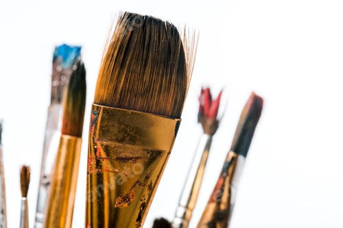 Preview: close up of paintbrushes with paint isolated on white