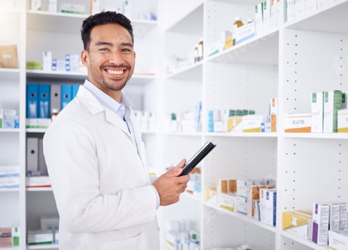 Preview: Man, portrait and pharmacist with tablet in pharmacy, drugstore or shop. Face, technology and Asian