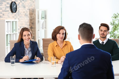 Preview: Human resources commission conducting job interview with applicant in office