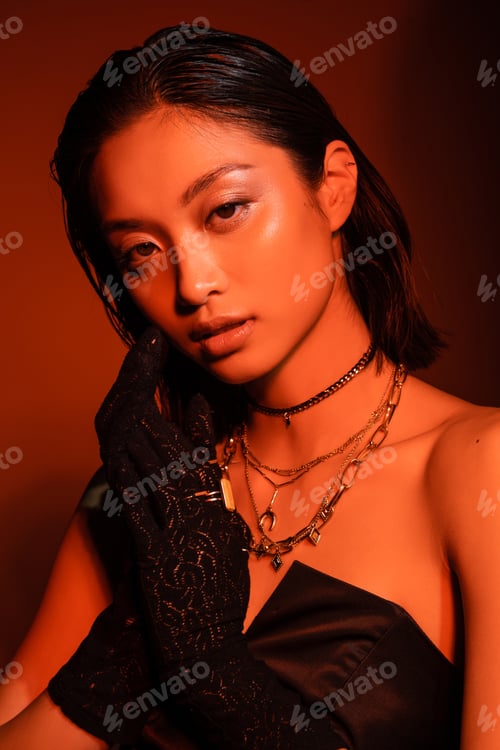 Preview: portrait of alluring asian young woman with short hair and wet hairstyle posing in black strapless