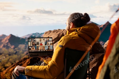 Preview: Business employee uses high speed internet connection on mountain top