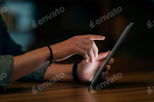 Preview: Male hands touching digital pad pc screen, using gadget at night