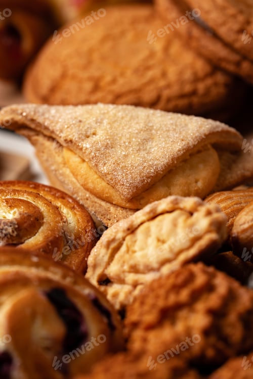 Preview: Assorted baked goods displayed on a wooden table, showcasing various textures and shapes