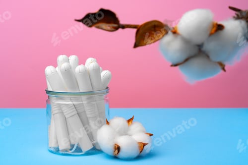 Preview: Female medical tampons on pink and blue background