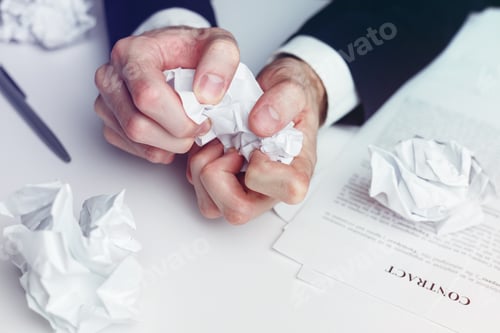 Preview: Stressed businessman crumple paper contract and documents - failed deal and crisis concept
