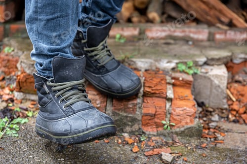 Preview: A pair of durable men's boots, legs close-up.