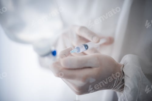 Preview: professional doctor and nurse are wearing PPE suit protection and looking for coronavirus
