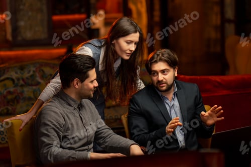 Preview: office sitting in yellow chairs two male workers discuss a project with a female director scolding