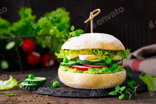 Preview: Hamburger with homemade ciabatta bun bread, boiled egg, radish, cucumber, lettuce salad
