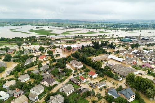 Preview: Aerial view of flooded houses with dirty water of Dnister river in Halych town, western Ukraine.