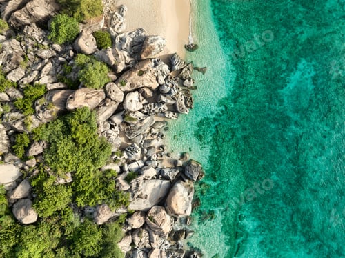 Preview: Rocky beach on island with tropical blue water