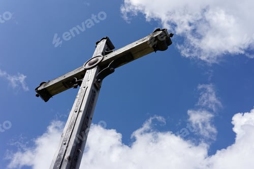 Preview: Wooden cross against a blue sky