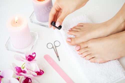 Preview: A woman does a pedicure on her own at home