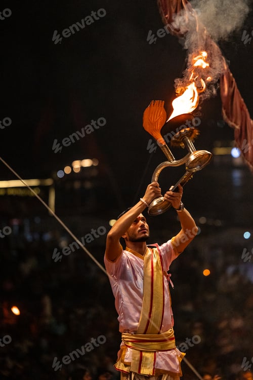 Preview: Hindu priest holding aarti during Ganga aarti ceremony in Varanasi